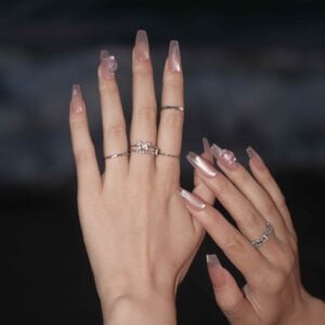 A close up of a hand wearing Aroma Drift Long Press On Nails, handmade by Fasunidy